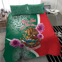 Green and red bedding set with Aztec symbols, eagle graphic, and purple flower details