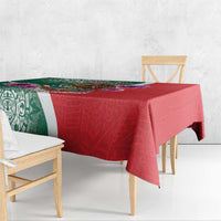 Green and red Independence Day tablecloth draped over rectangular table