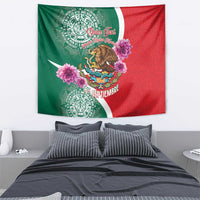 Green and red independence tapestry with eagle crest, pink blossoms, Aztec coin patterns