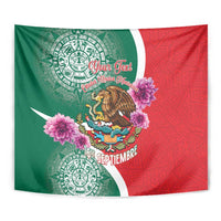 Close-up green and red independence tapestry with eagle, pink flowers, Aztec medallions