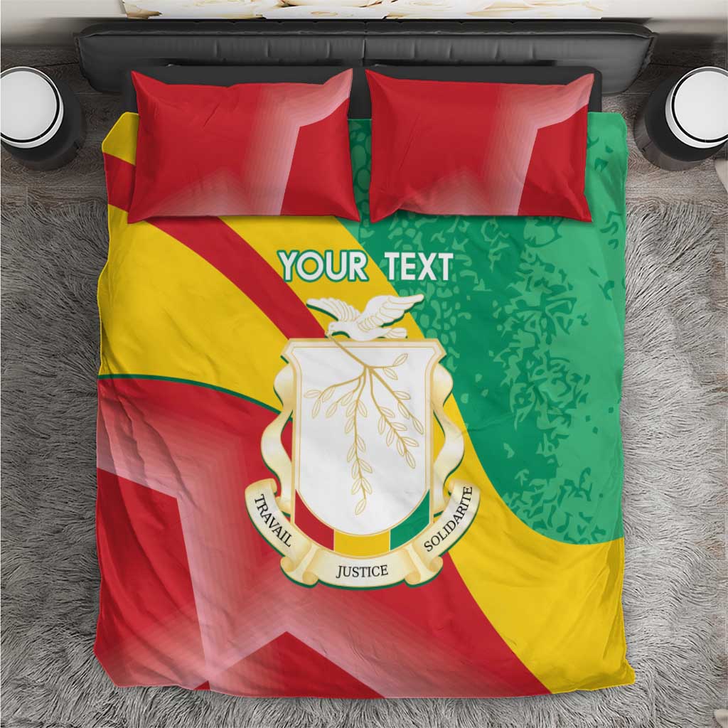 Guinea bedding set top view: YOUR TEXT on multicolor duvet with coat of arms, red pillows