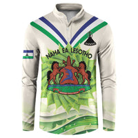 Ivory button-up sweatshirt with Lesotho flag diagonal stripes and colorful graphic front
