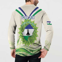Ivory button-up sweatshirt with back Lesotho map graphic, bell icon, and stripe accents