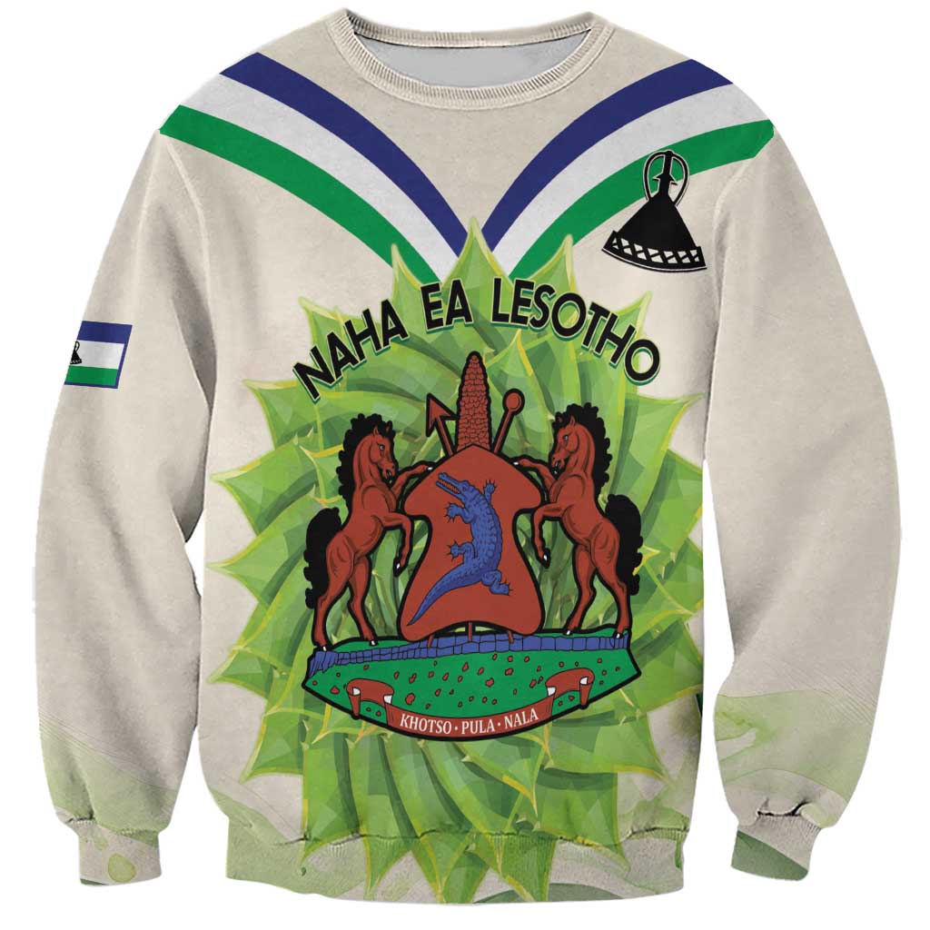 Unisex ivory crewneck sweatshirt with front Lesotho-style coat of arms graphic