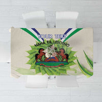 Ivory personalized tablecloth with coat of arms, green aloe leaves, and 'YOUR TEXT'