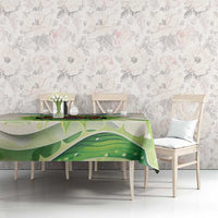 Ivory tablecloth with large green aloe leaf print across the table top