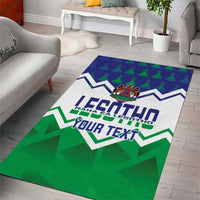 Personalized green and blue area rug laid on light wood floor, LESOTHO and Your Text
