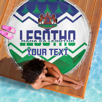 Round beach blanket with fringed edge, white base, blue and green zigzags, crest, 'YOUR TEXT'
