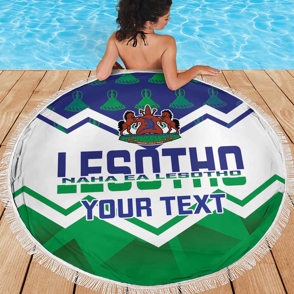 Round beach blanket with 'YOUR TEXT' and Lesotho crest, blue and green zigzag chevrons