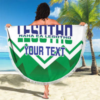 Round beach blanket with fringed edge, Lesotho crest and 'YOUR TEXT' on blue/green zigzags