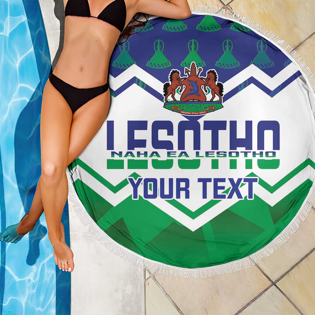 Round beach blanket with fringed edge, white background, Lesotho crest, 'YOUR TEXT' chevrons