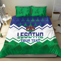 Personalized Lesotho bedding set with two green pillows and crest zigzag duvet