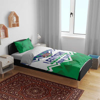 Personalized Lesotho bedding set with green pillows and blue/white zigzag crest duvet
