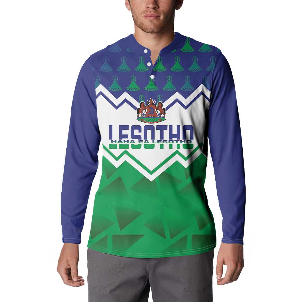 Navy button-collar sweatshirt with Lesotho crest and green patterned graphic front