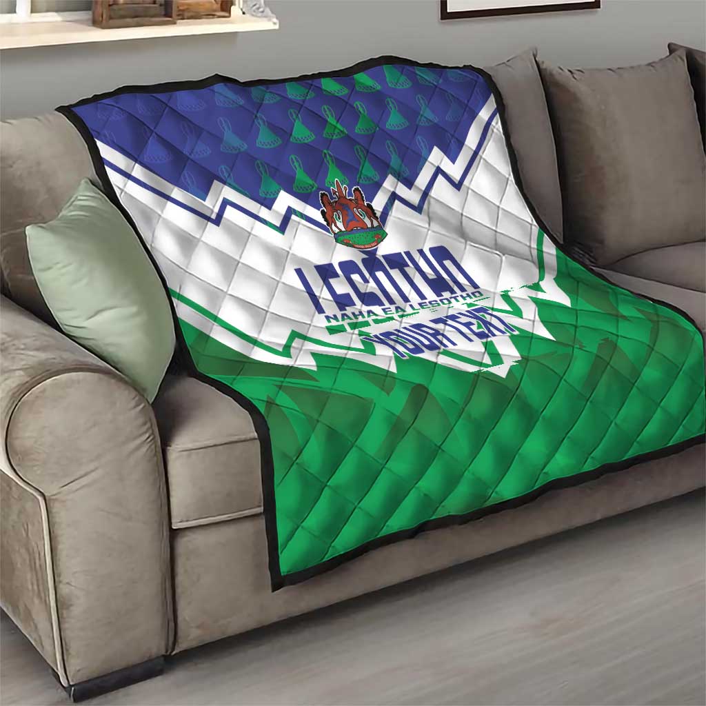 Personalised quilt draped over a sofa with blue, white, and green chevron pattern