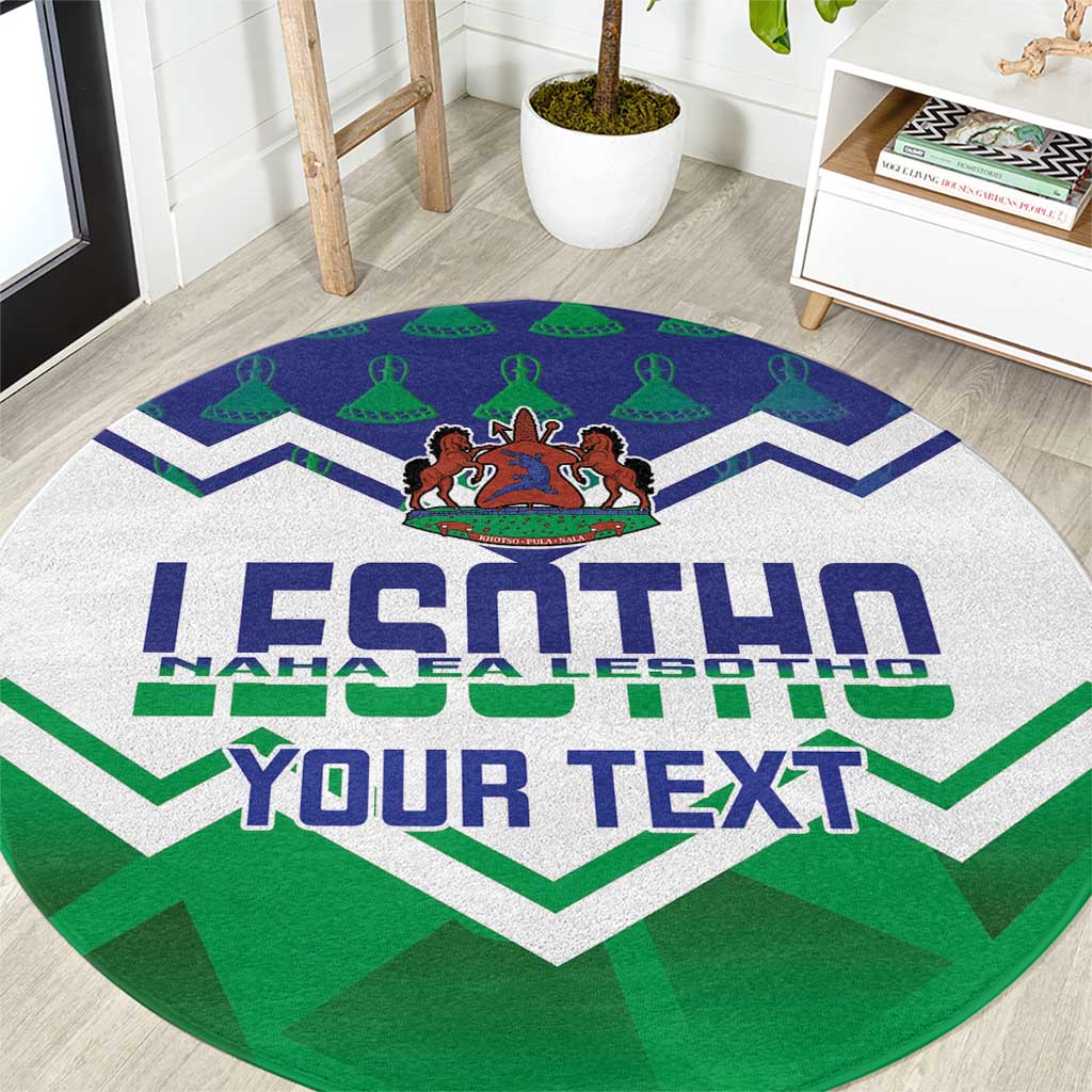 Round green rug close-up with big LESOTHO lettering, zigzag chevrons and emblem
