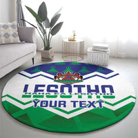 Round green rug with LESOTHO and YOUR TEXT across white-and-blue chevrons, emblem