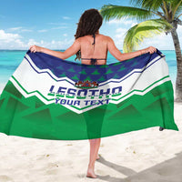 Green and white Lesotho sarong with central crest and 'LESOTHO YOUR TEXT' design