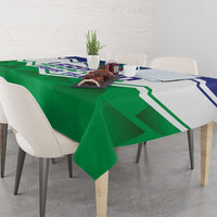 Green tablecloth with zigzag graphic stripe pattern on dining table