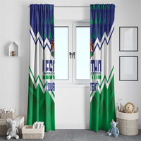 Lesotho-themed window curtain with blue top, green zigzag stripes, crest, and 'YOUR TEXT'.