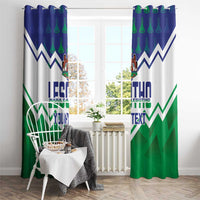 Lesotho-themed window curtain with blue top and green zigzag pattern, crest emblem, and text.