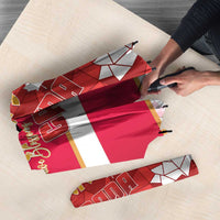 Red umbrella canopy with Canada flag stripes and geometric maple leaf pattern