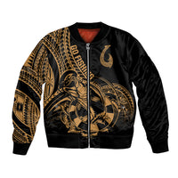 Unisex bomber jacket in black with gold Polynesian fish-hook tattoo graphic, zip front.