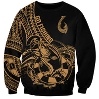 Black sweatshirt with gold fishhook tattoo and Polynesian pattern on chest and sleeves