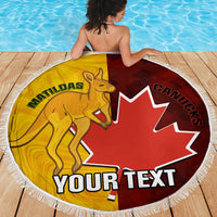 Round beach blanket with gold kangaroo and red maple-leaf center, white fringe edge