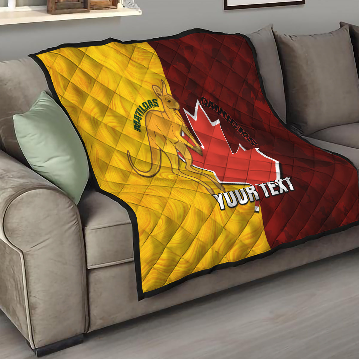Gold and burgundy soccer quilt draped on a sofa with Canada and Matildas graphics