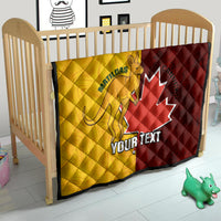 Gold and burgundy soccer quilt on a crib with Canada maple leaf and Matildas emblem