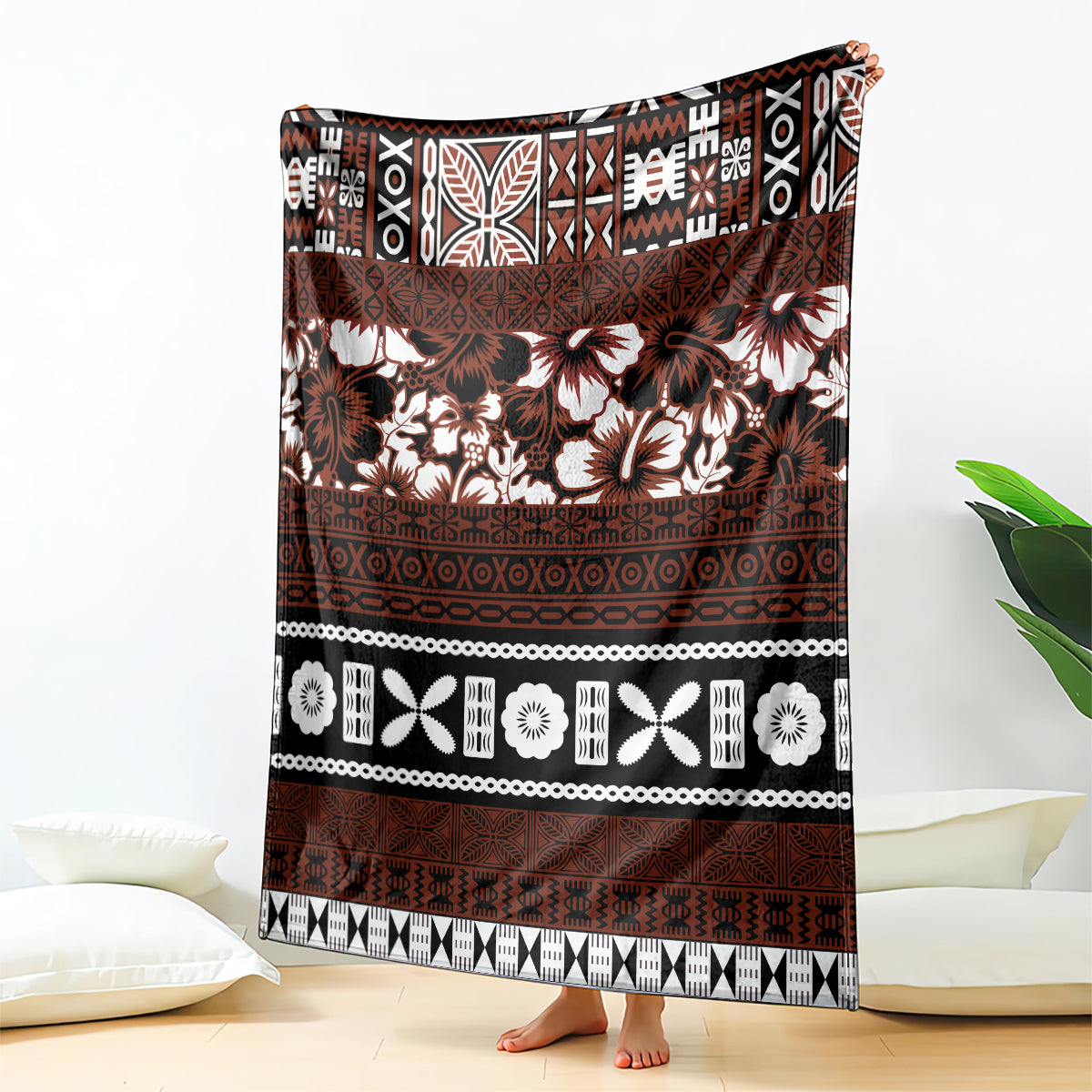Brown tapa-style blanket with white hibiscus floral and geometric patterns