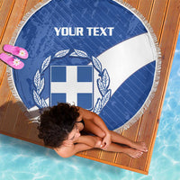 Round blue and white crest beach blanket with white fringe, corner draped
