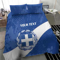 Blue and white duvet set with Greece shield crest, wreath, and “YOUR TEXT” lettering