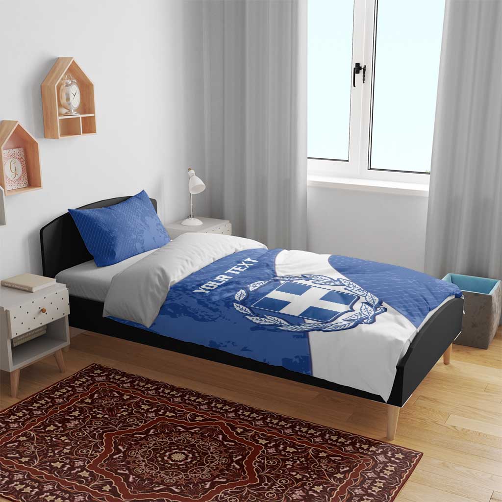 Blue and white football bedding set on bed, with Greece crest emblem and “YOUR TEXT”