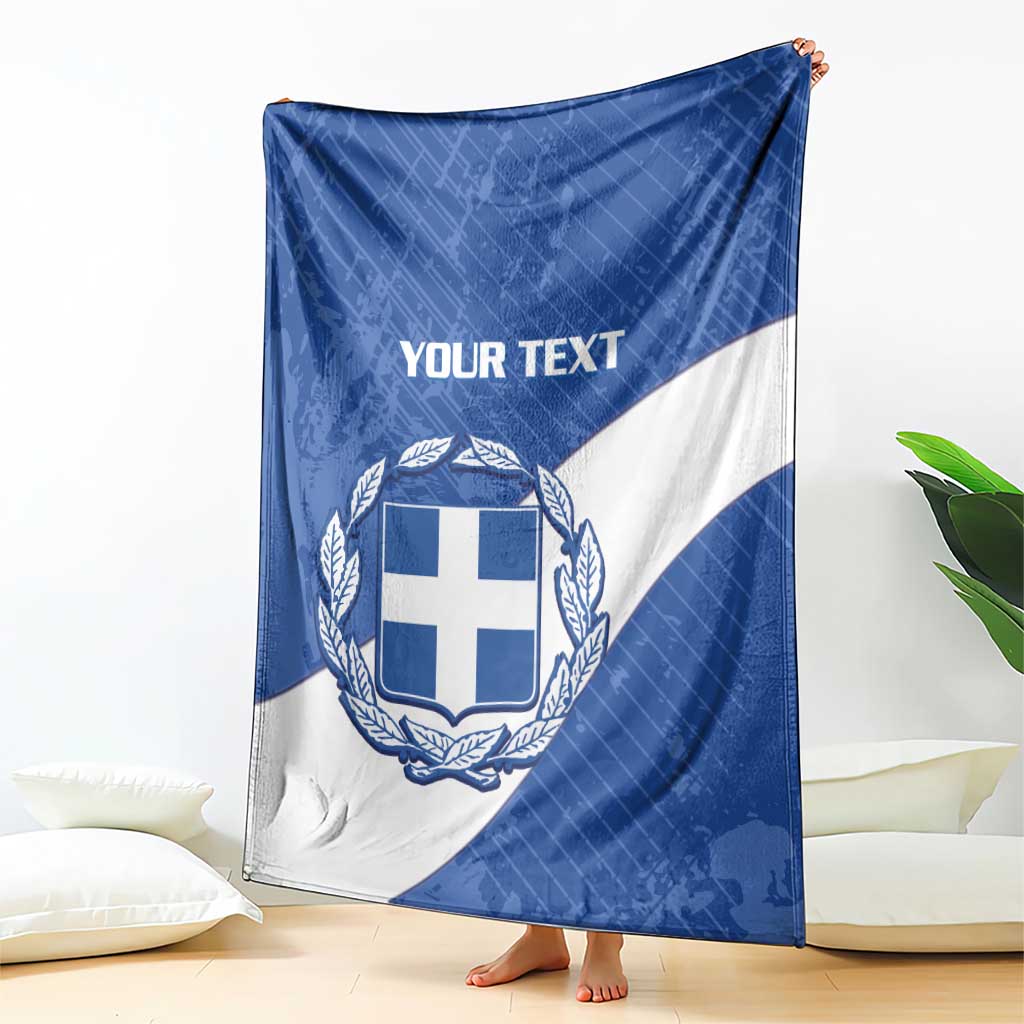 Blue and white Greece football blanket draped with crest and 'YOUR TEXT' heading