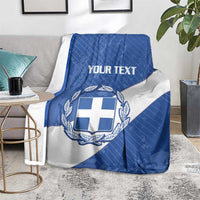 Blue and white Greece football blanket on a floor with crest and 'YOUR TEXT' centered