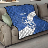 Blue quilt blanket on sofa with Greece crest, white diagonal stripe, and 'YOUR TEXT'