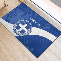 Blue doormat featuring Greece shield crest, laurel wreath, and white wave stripe