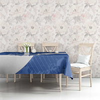 Blue football tablecloth on dining table with overhanging corners