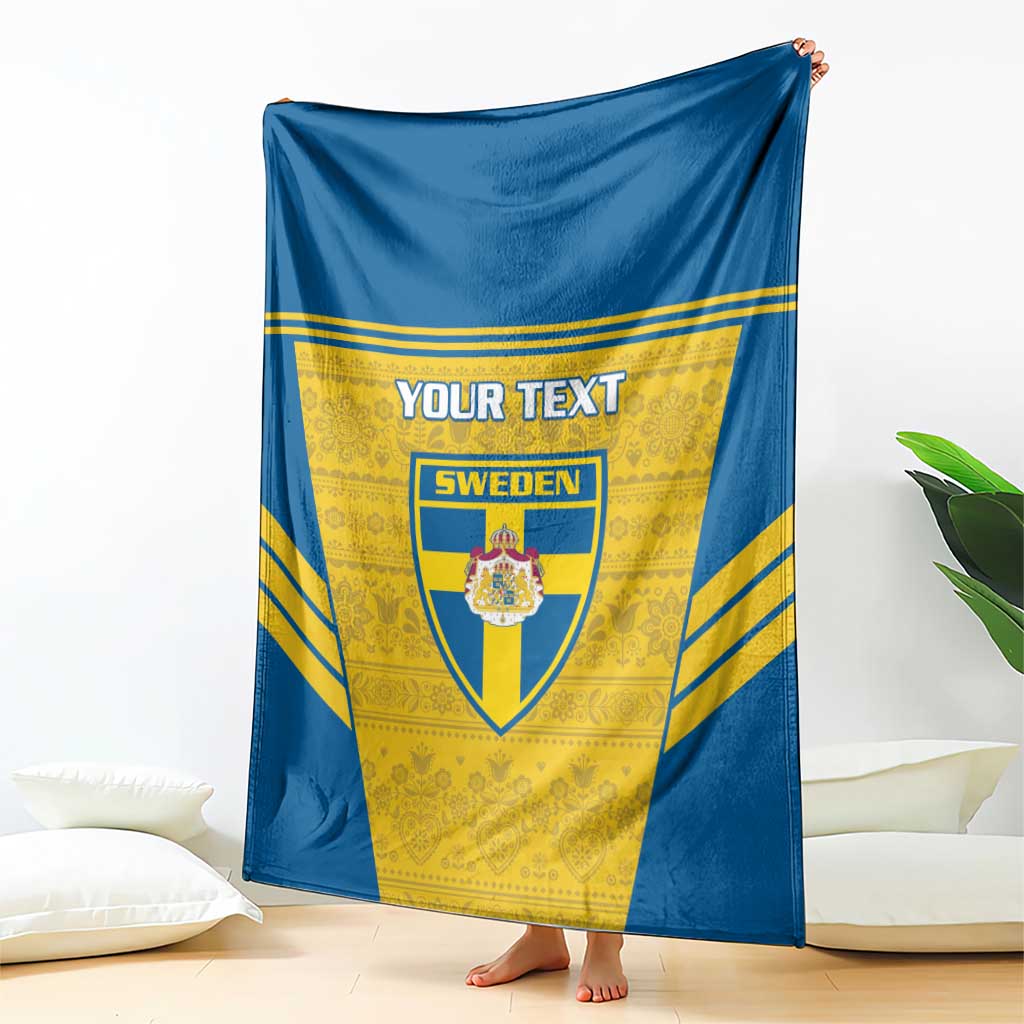 Blue and yellow Sweden football blanket with custom text and crest, hanging over sofa