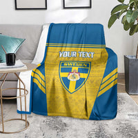 Blue and yellow Sweden football blanket with custom text and crest, spread on living room floor