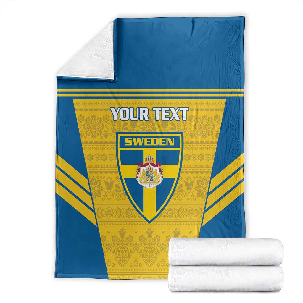 Blue and yellow Sweden football blanket with custom text and crest, folded with rolled towels