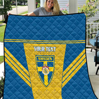 Blue quilt blanket with yellow Sweden panel, “YOUR TEXT” and crest detail