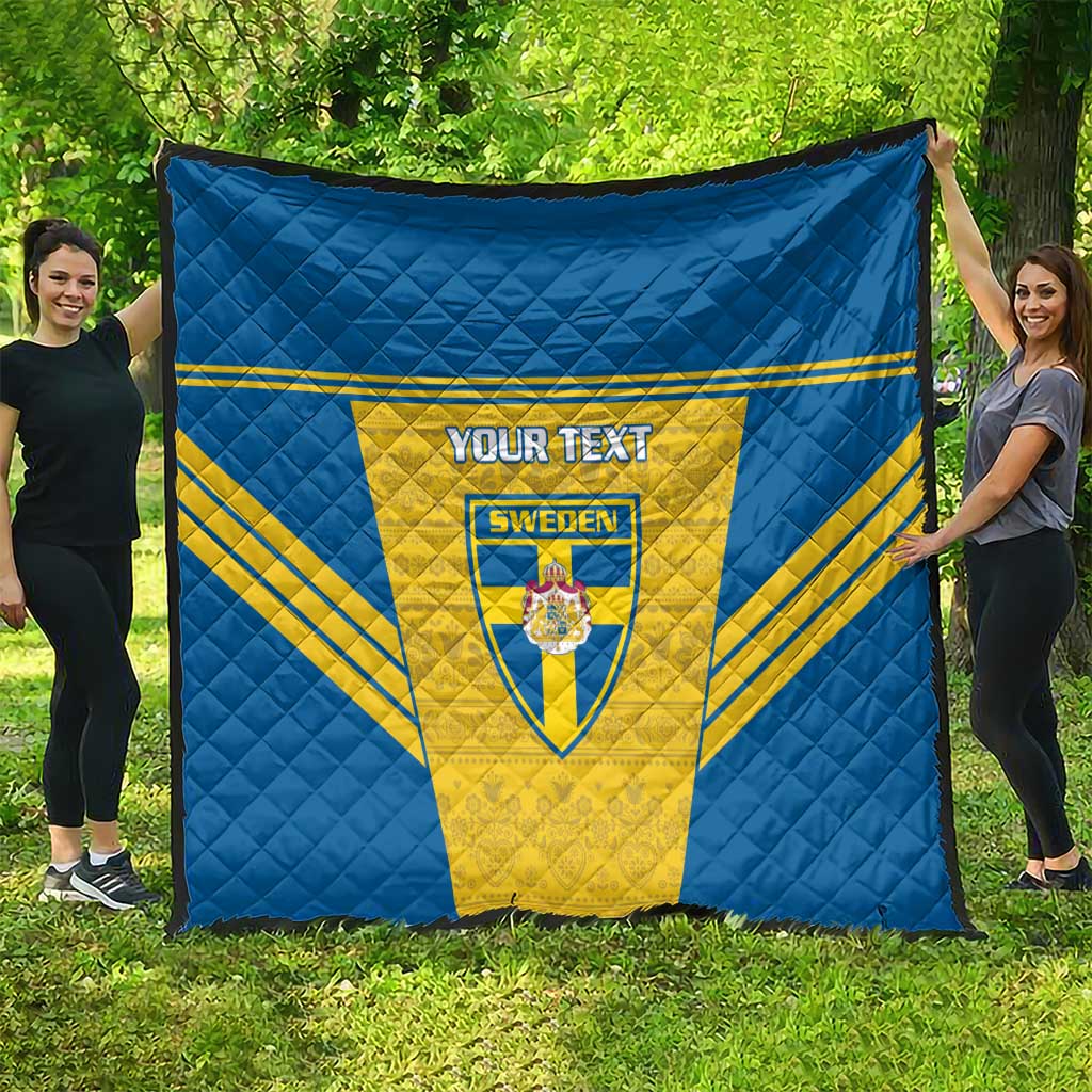 Blue and yellow Sweden quilt blanket stretched outdoors with custom “YOUR TEXT” panel