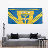 Blue wall tapestry with Sweden crest, gold rays, and YOUR TEXT banner in center