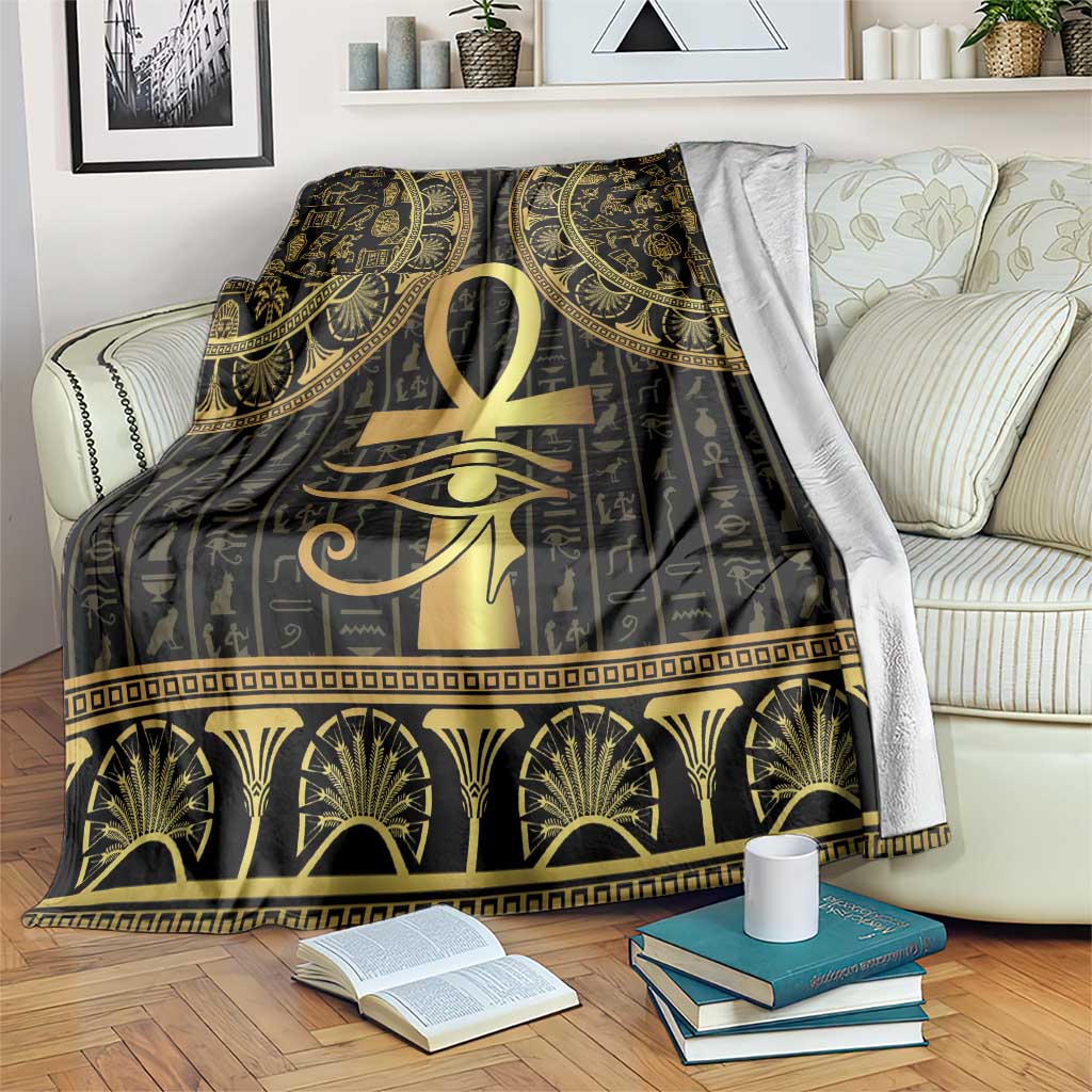 Black Egyptian-style throw blanket with gold Ankh and Eye of Horus and hieroglyph patterns