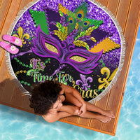 Round purple beach blanket with carnival mask and "It's Time for Mardi Gras" text