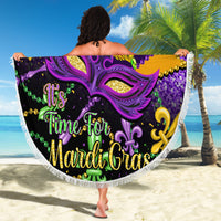 Round purple beach blanket with purple carnival mask, fleur-de-lis accents, white fringe