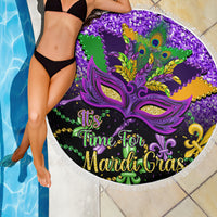 Round purple beach blanket with carnival mask design and white fringe edge